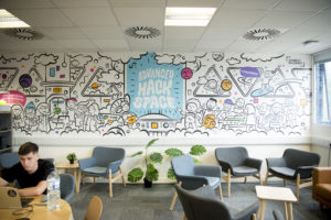 The Hackspace mural wall in the coworking zone