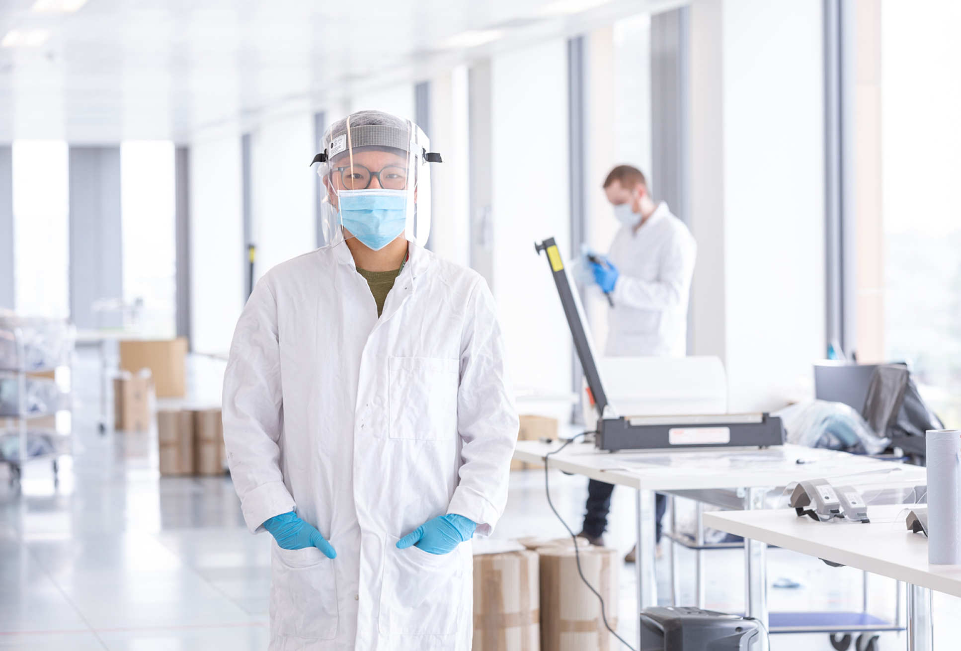 women demonstrating wearing PPE 